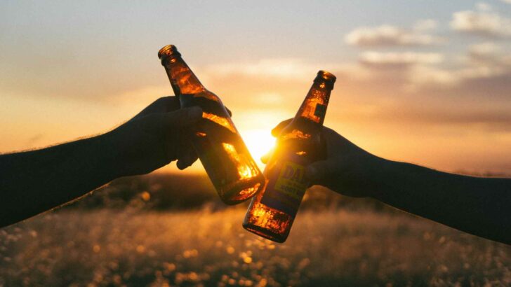 Friends clinking glasses of beer in a toast