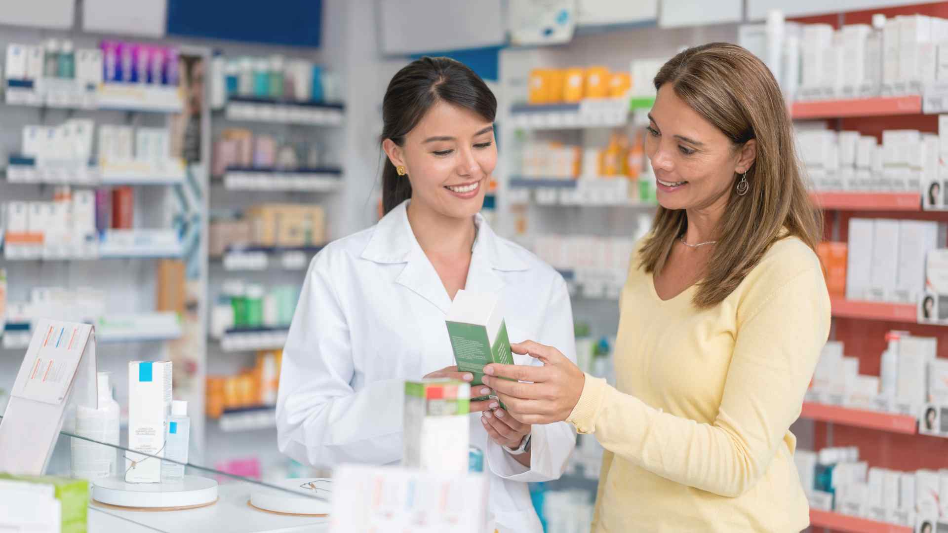 Pharmacist helping a customer at the medicine counter