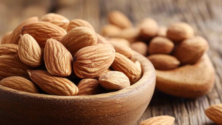 Nuts spilling from a wooden bowl