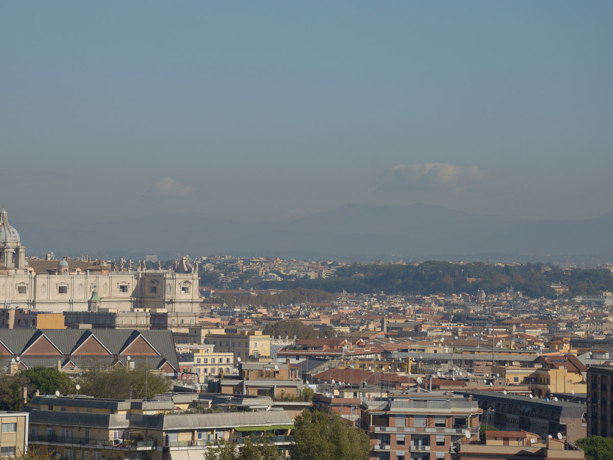 Panoramic daytime view across the rooftops and landmarks of Rome