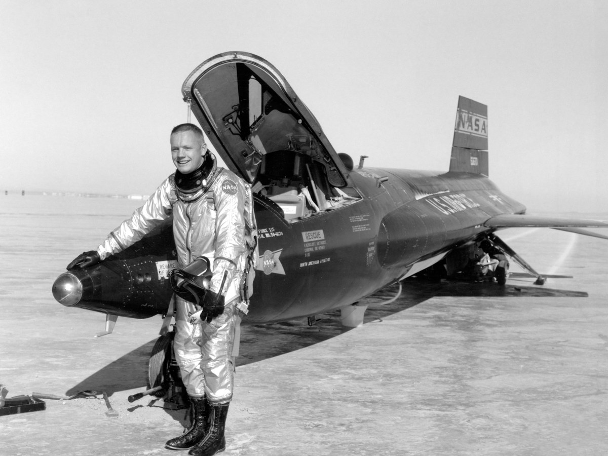 Test pilot Neil Armstrong standing beside an X-15 aircraft