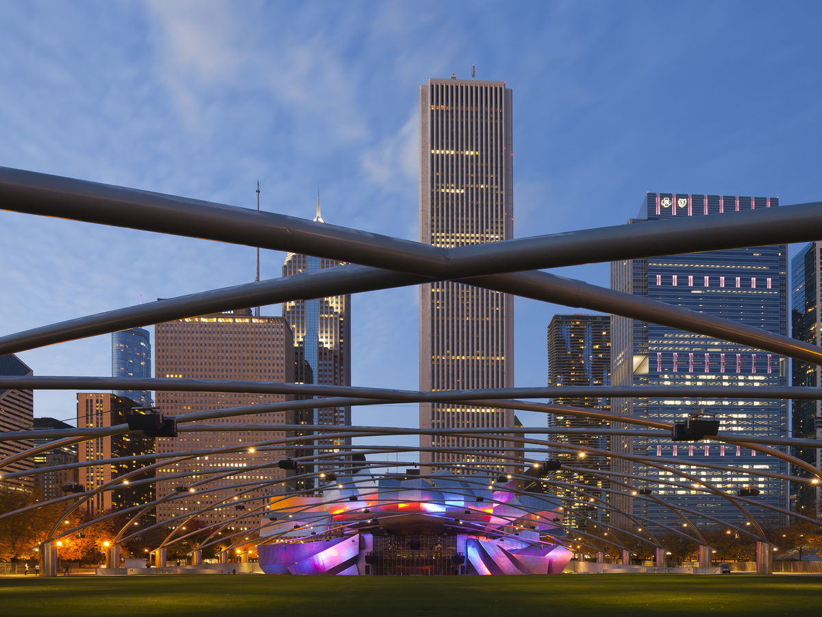 Downtown Chicago buildings viewed through the Pritzker Pavilion structure