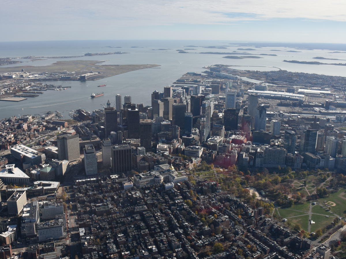 Aerial view of downtown Boston, the harbor, and surrounding neighborhoods