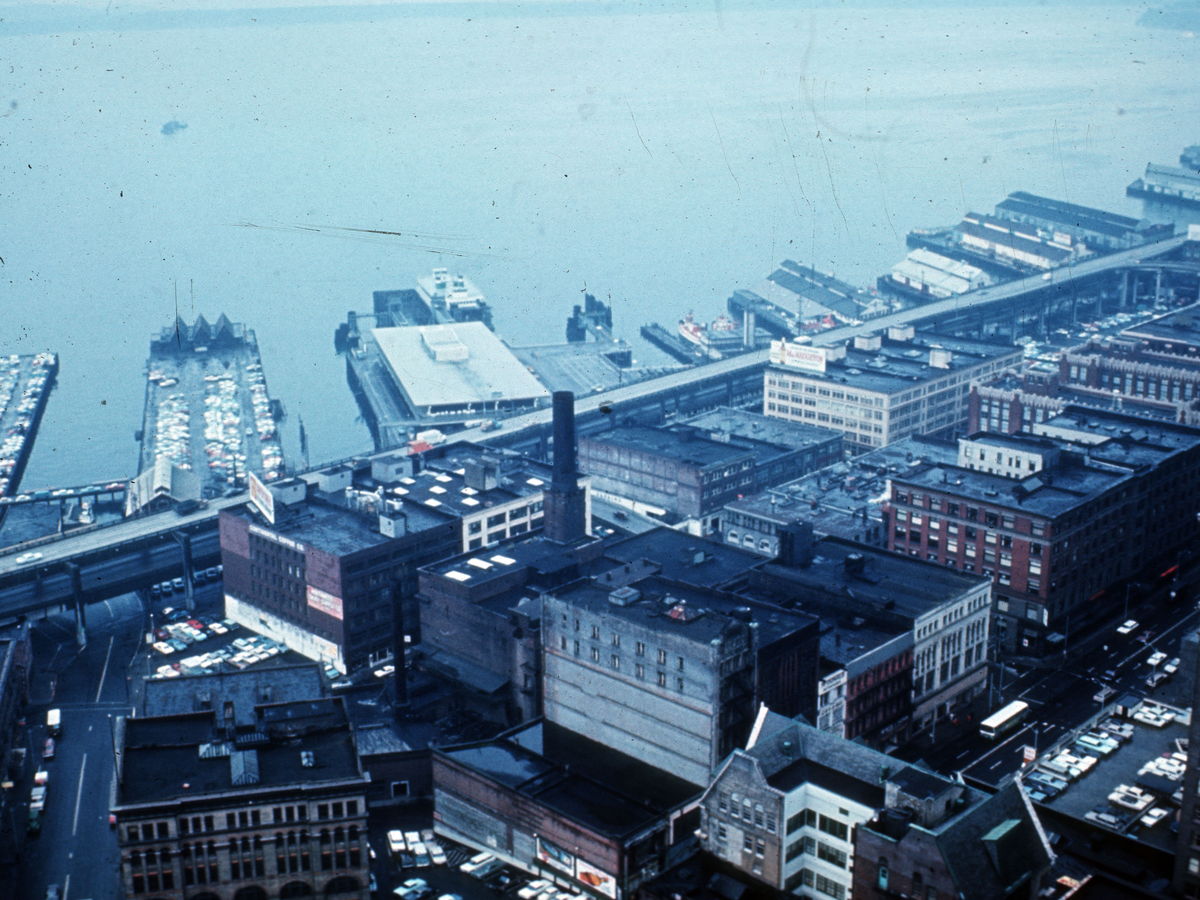 Historic aerial view of Seattle waterfront buildings and piers