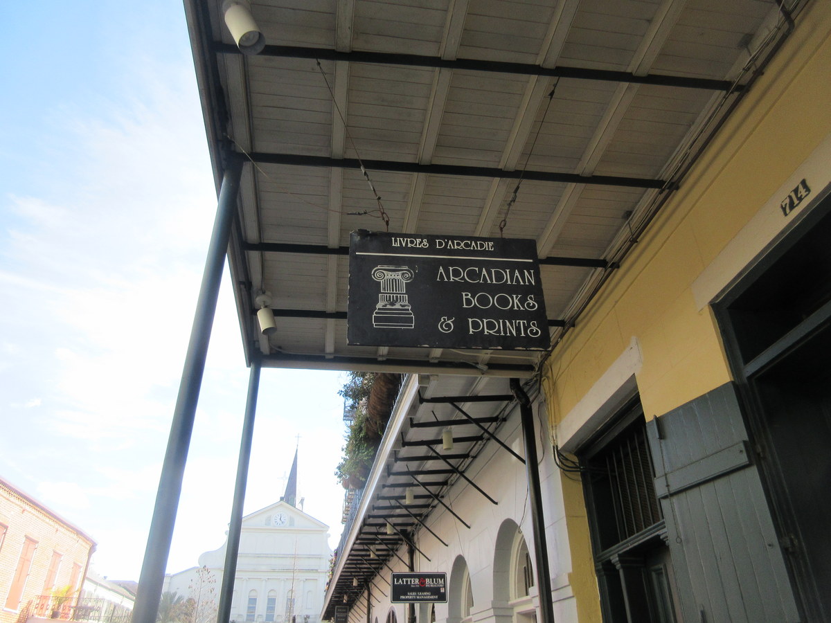 Covered arcade and historic storefronts in the New Orleans French Quarter