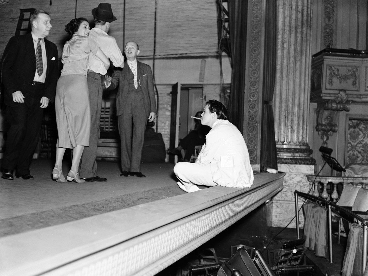 Actors performing together on a theater stage