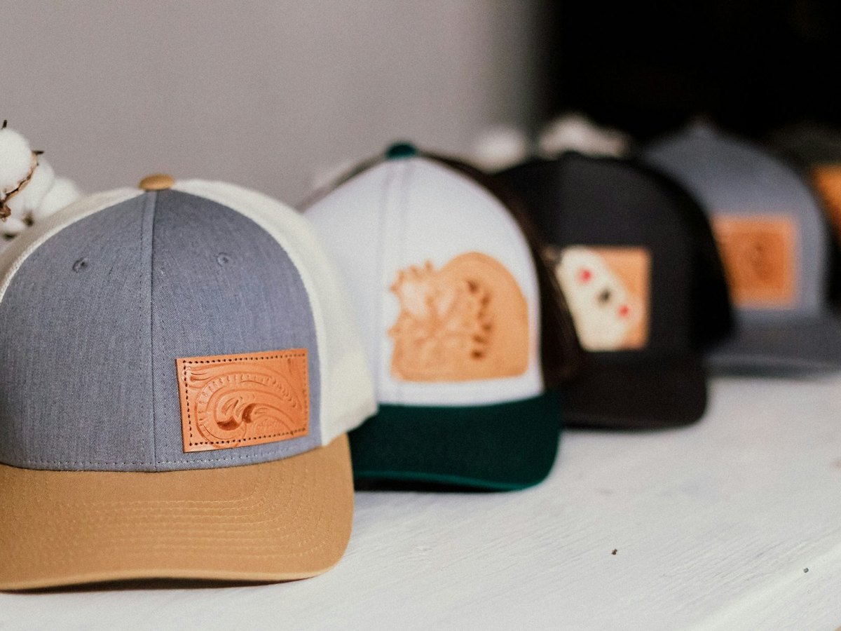Five assorted baseball caps arranged in a row