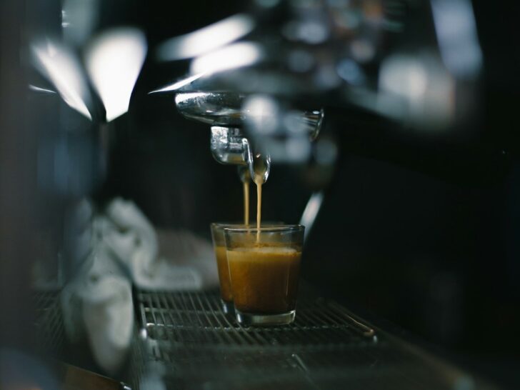 Barista pulling a fresh espresso shot from a coffee machine