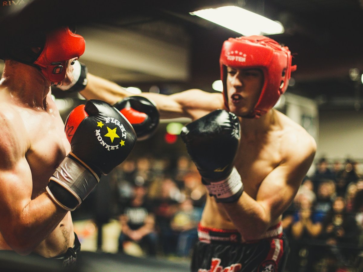 Two amateur boxers sparring during a match