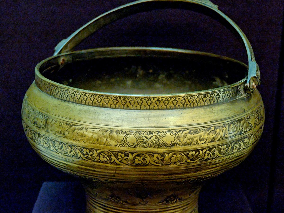 Round historic bucket displayed at the Louvre