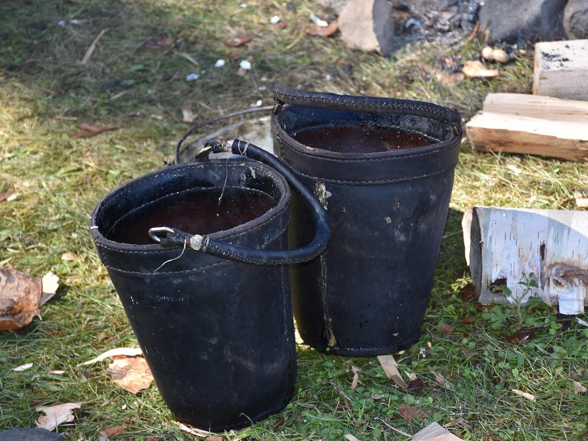 Hand-sewn leather buckets with metal ring handles