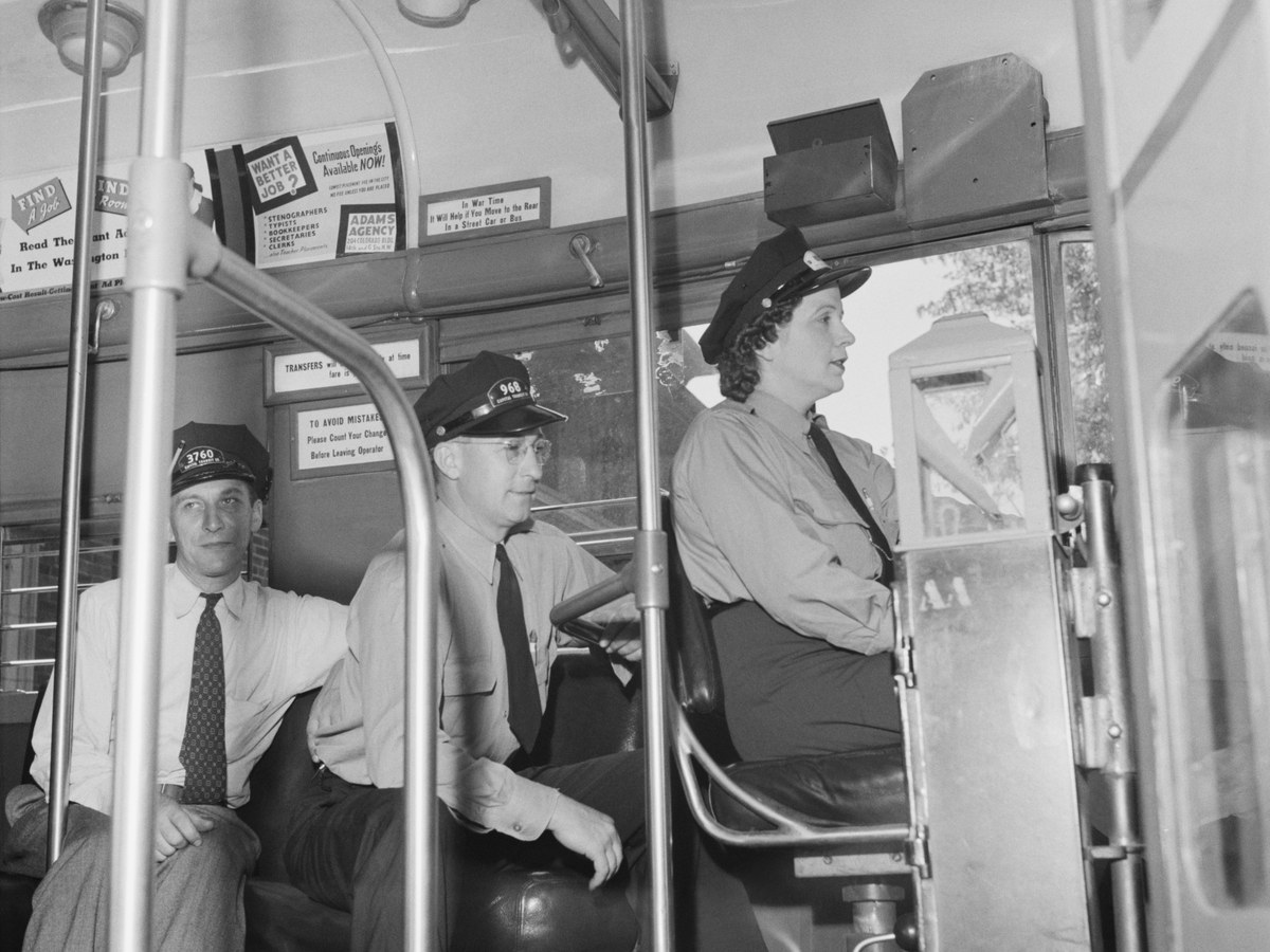 Passengers and driver inside a historic city bus