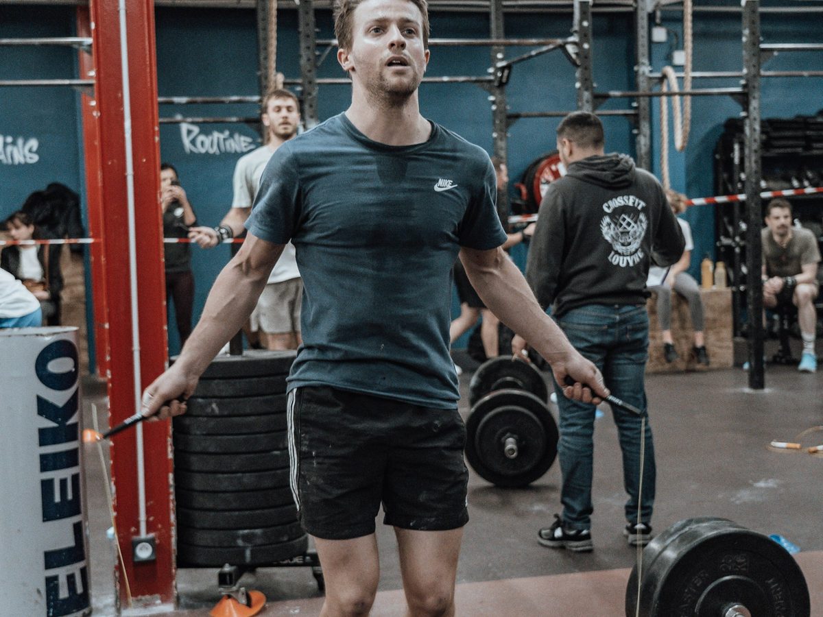 Athlete using a jump rope for cardio training in a CrossFit gym
