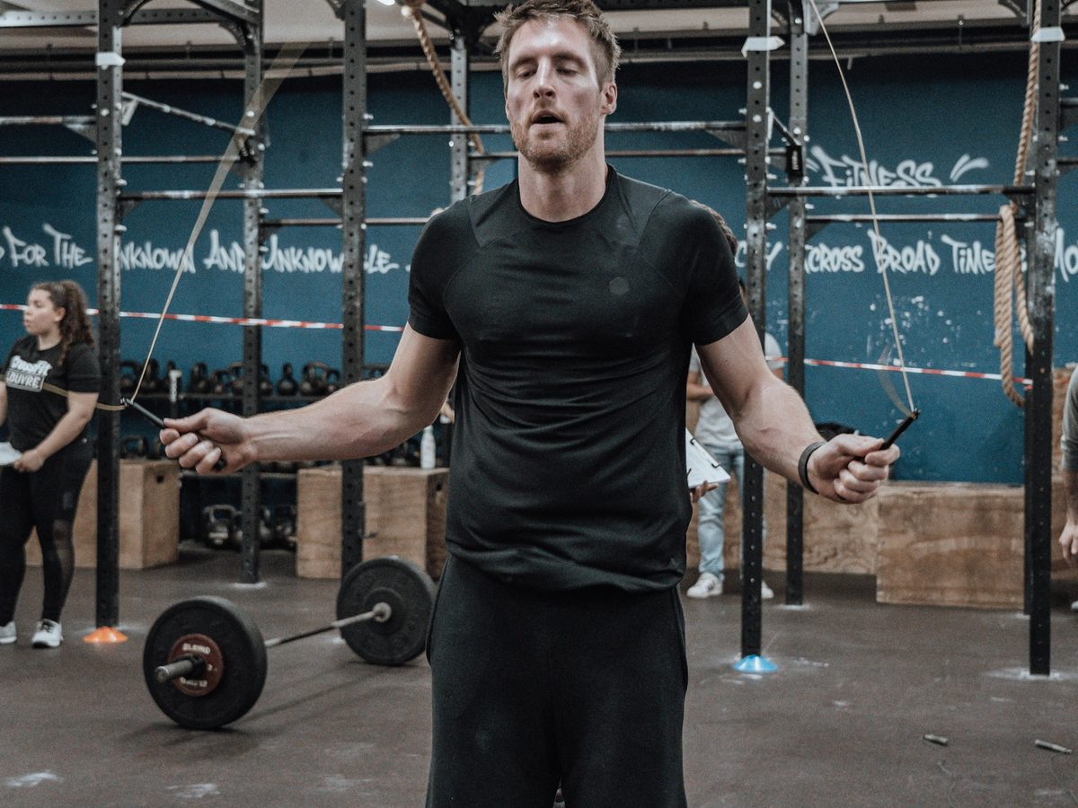 Athlete performing a jump rope cardio workout in a gym
