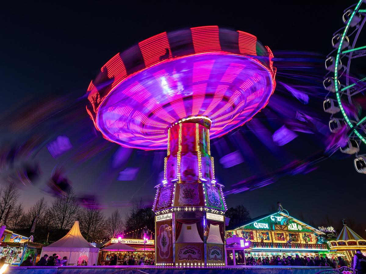 Colorful chair-swing ride at a busy carnival