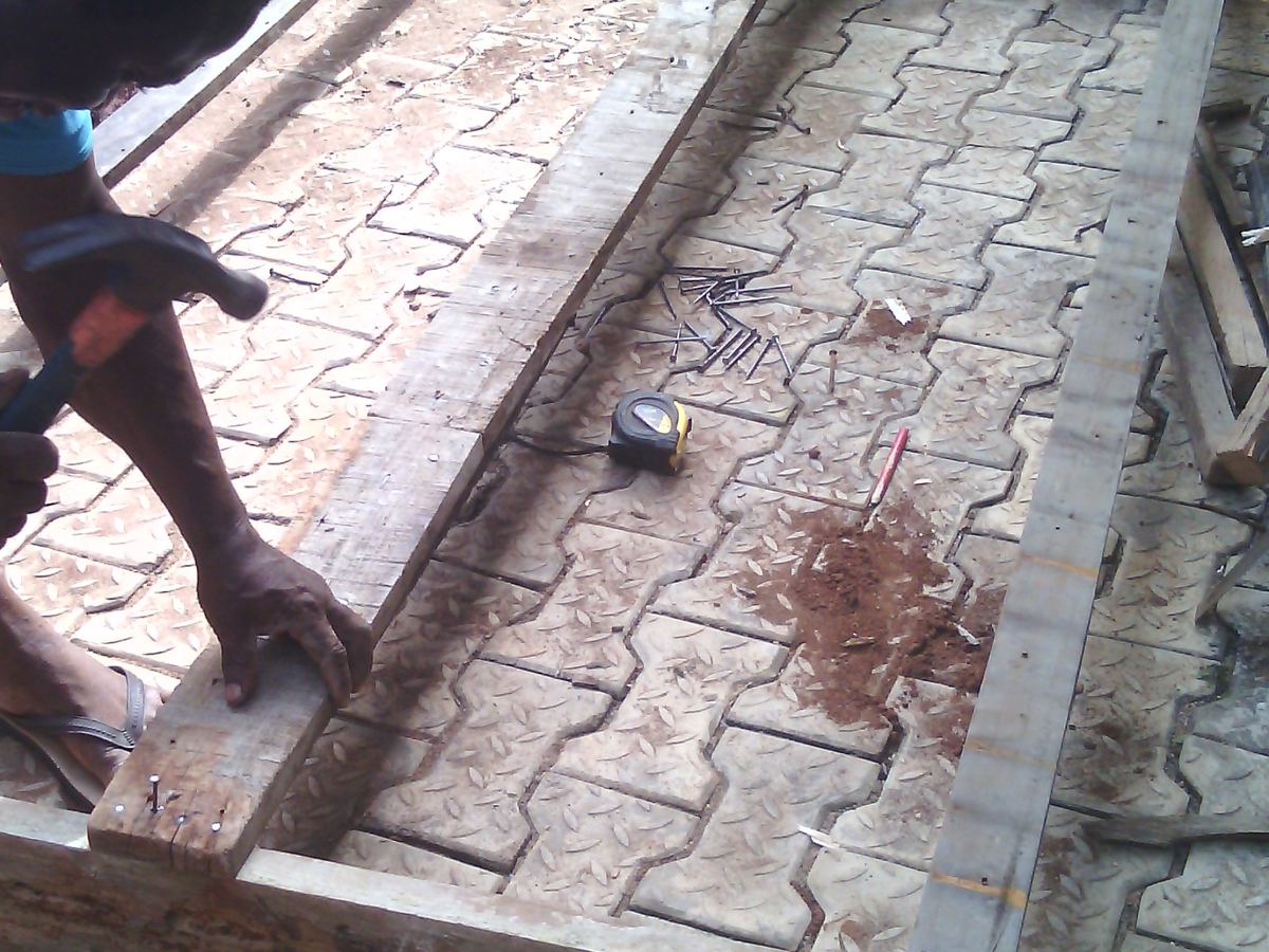 Carpenter using hand tools on a woodworking project