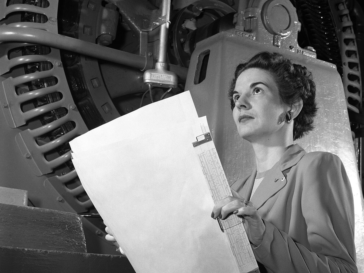 Electrical engineer Kitty Joyner operating an industrial control panel