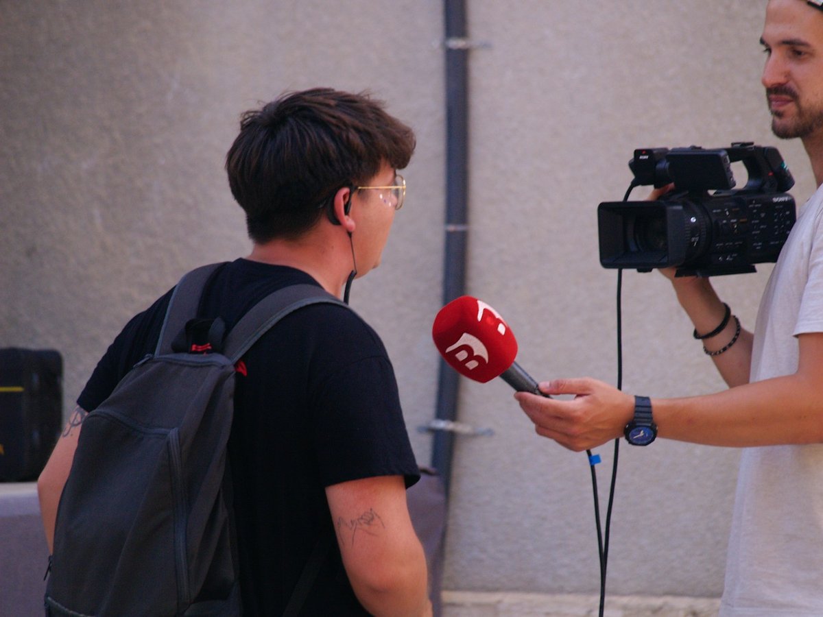 Reporter holding a microphone during an interview