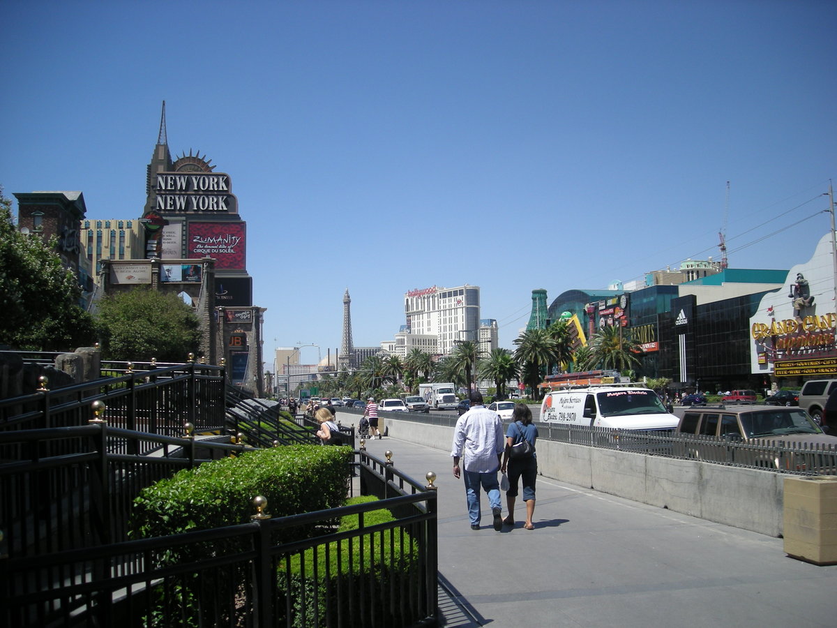 Pedestrians walking along the Las Vegas Strip by day