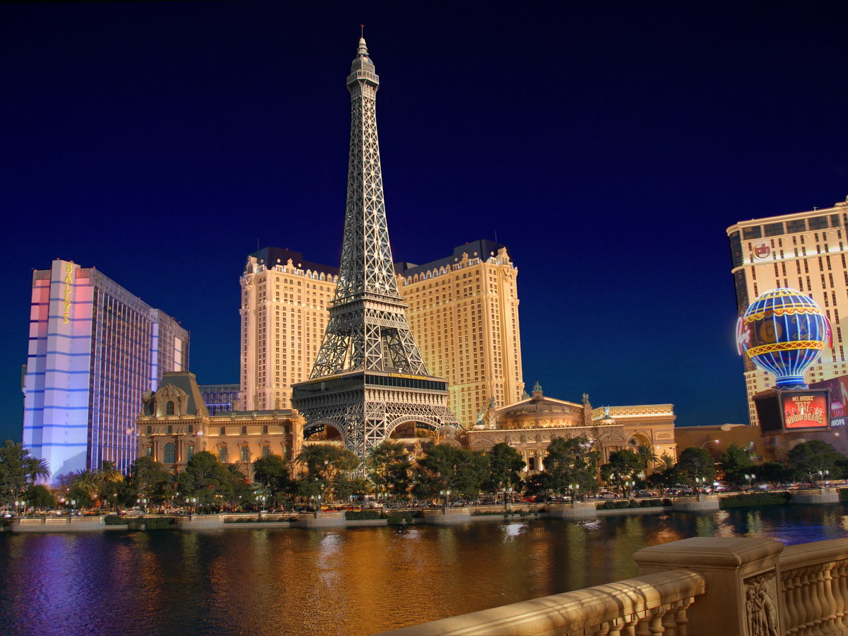Paris Las Vegas hotel and Eiffel Tower replica illuminated at night