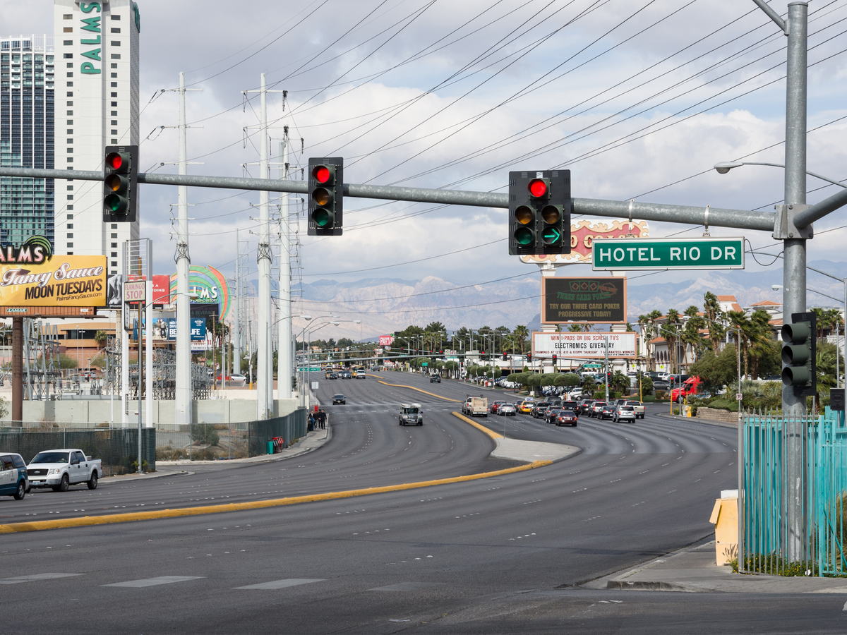 Wide Las Vegas boulevard intersection lined with hotels