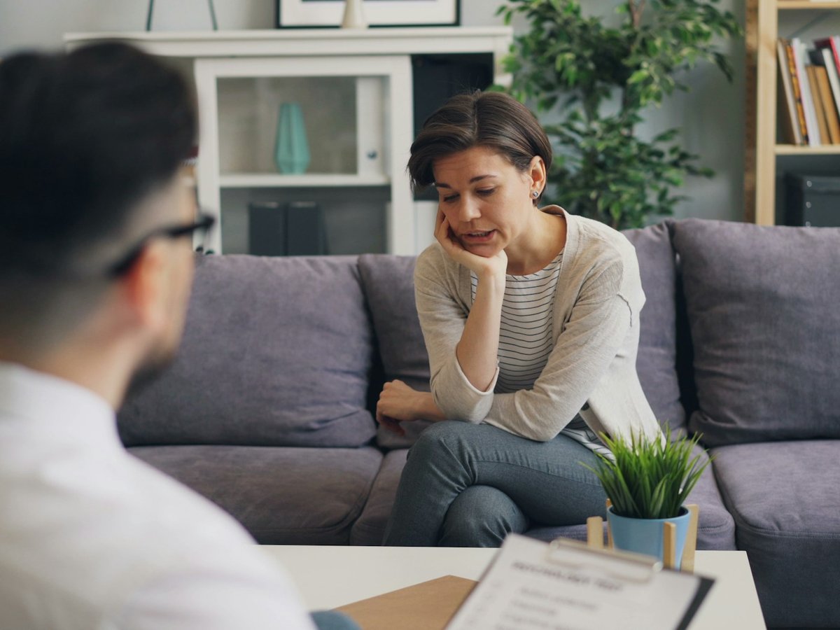 Psychologist speaking with a client during a counseling session