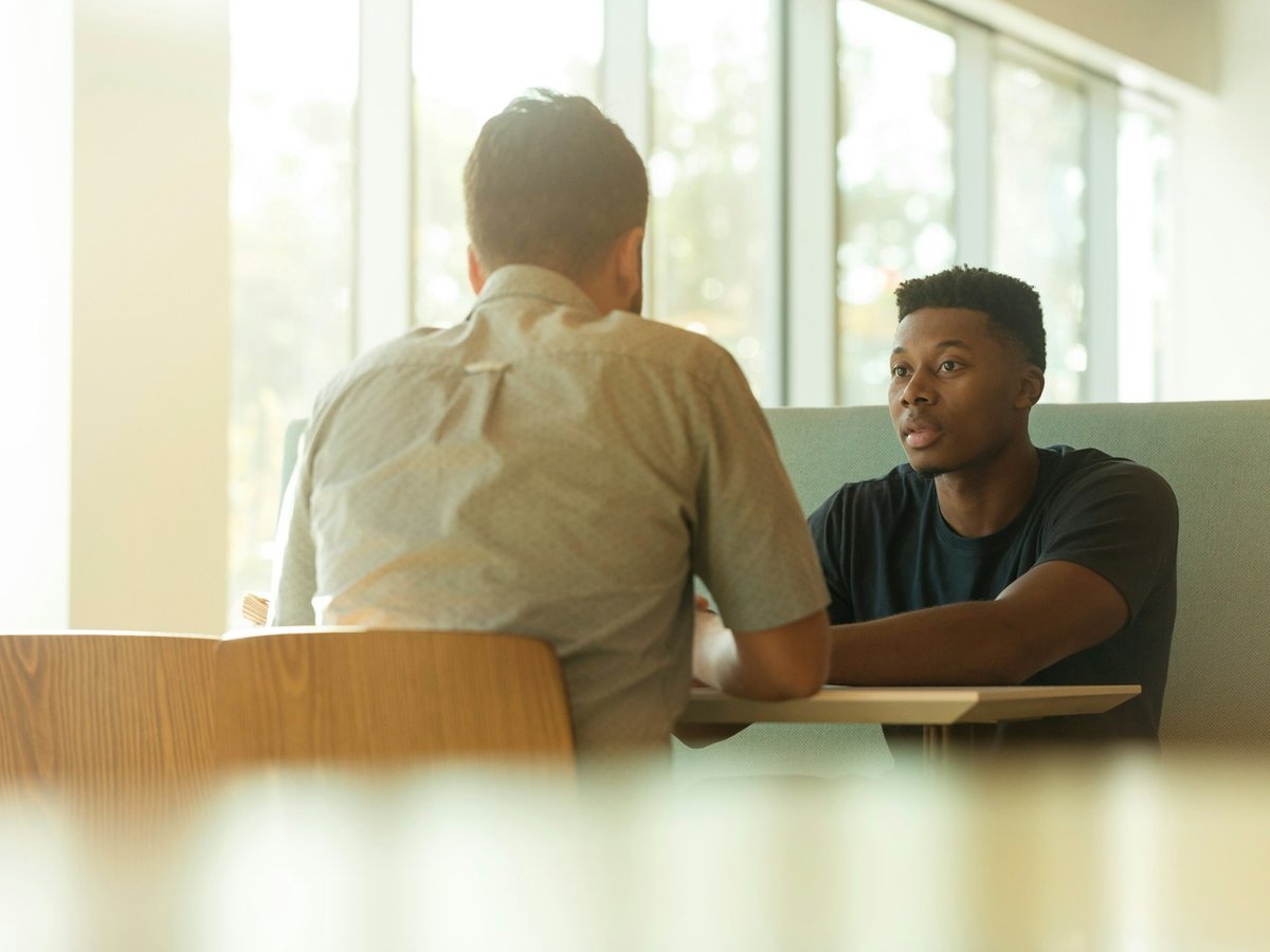 Therapist and client talking across a table