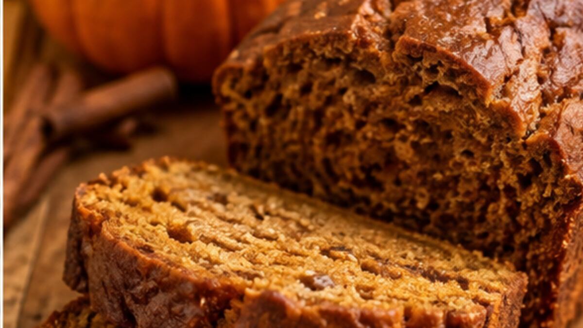 Pumpkin spice bread with a small pumpkin